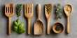 © Anucha - Collection of wooden kitchen utensils and herbs including spatula fork spoon and fresh green basil and rosemary on neutral background