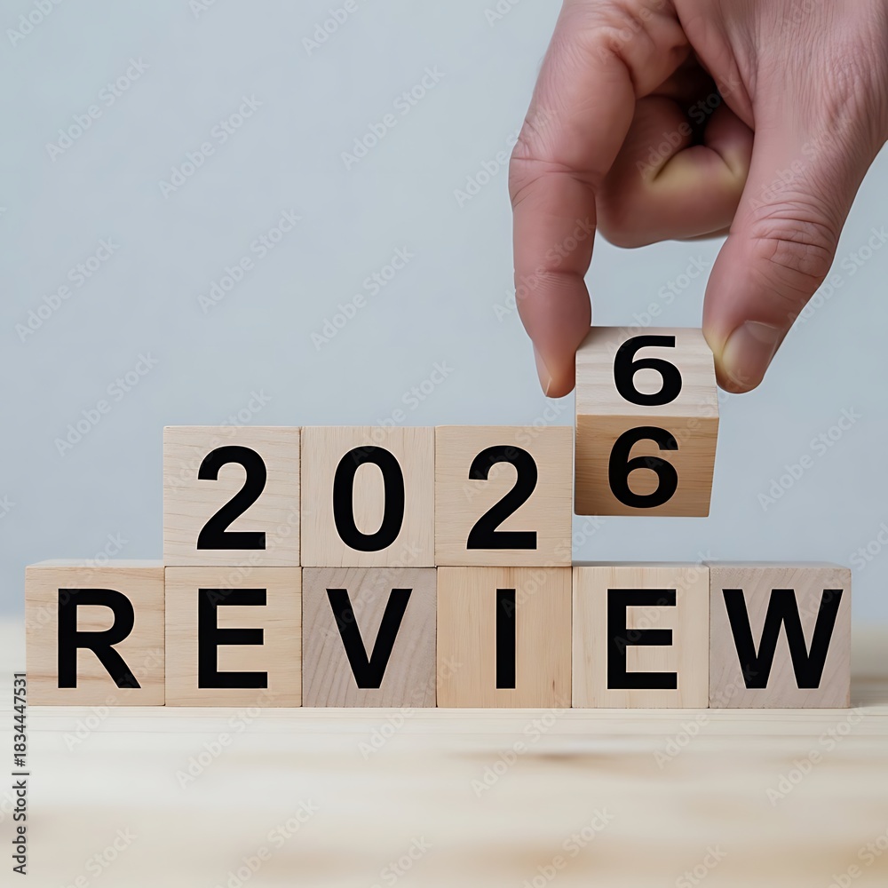 Preparing for the 2026 review hand changing wooden blocks Stock Photo ...
