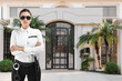 © New Africa - Security guard near house outdoors. Private property protection