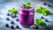 © hardvicore - Blueberry smoothie in glass jar, tiny fresh mint leaf, vibrant deep purple color. Tasty drink