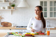 © BestForYou - Woman in the kitchen preparing nourishing meals by chopping fresh vegetables, adhering to the principles of balanced diet.