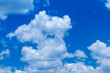 © Wittke Photography - Photograph of white cumulus clouds drifting across a bright and vibrant blue sky in the Blue Mountains in NSW, Australia.