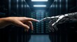 © IQ-Photography - Human and robot hands reaching out to touch in a dark server room with glowing lights behind them