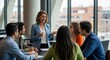 © Tatiana - Woman business leader or professor provides mentoring to diverse group of young adults in modern office. Education and corporate development concept.