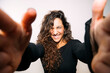 © karrastock - Excited young woman reaching out for a selfie