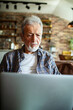 © Geber86 - Senior man worried while using laptop at home