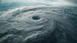 © Anna Iluschenko - Dramatic aerial view of a powerful cyclone eye over the ocean - an extreme weather and atmospheric phenomenon
