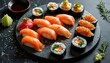 © Viktor - Sushi and rolls arrangement on dark stone. Food photography presents assorted sushi pieces. Japanese cuisine with fresh ingredients. Colorful seafood set for menu. Asian food for restaurant design.