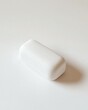 © BanklangArtshop - Minimalist white sponge on a clean surface.