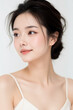 © Eggy - Female Asian Model with Short Hair - Young Beautiful Woman with Hair Bun - Studio Portrait of Asian Beauty for Fashion, Cosmetic, Skincare - Posing on White Background - Smooth Tied Hair