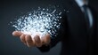 © CLOVER BACKGROUND - Digital Era in Hand: A conceptual artwork reveals the essence of the digital era, with sparkling particles delicately held within the open palm of a well-dressed individual.