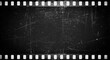 © Alice M - Black and white film strip frame with scratched texture and grain. Dark grunge background with vintage worn effect. Perfect for retro movie projects, photo borders, and creative designs.