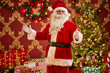 © SuperStock - Santa Claus in traditional red suit welcomes guests with decorated Christmas trees and wrapped presents