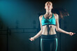 © peopleimages.com - Fitness, woman and jump with rope in gym for cardio exercise, training and health with space. Skipping, athlete and person with workout for wellness in club, energy and burn calories for endurance