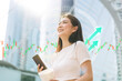 © dodotone - Beautiful smile young adult woman with increase stock graph growth investment financial goals