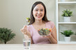 © Pormezz - Happy wellness meal, Woman eats salad as lunch and controls calories for the meal for her body care