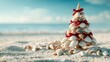 © keks20034 - Seashell Christmas tree on sandy beach by the ocean