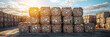 © plysuikvv - Bales of recycled paper stacked during the day Generative AI