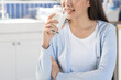 © Pormezz - Close-up woman a glass of drink milk in the morning