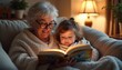 © Татьяна Кондратенко - Older woman reading a book to young girl wrapped in blanket at home