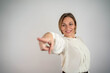 © Nenad - Portrait of a smiling business woman pointing at you, isolated on a white background.