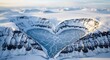 © lancelot - Stunning aerial view of a heart shaped frozen lake in the arctic mountains.