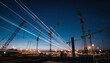© JARVIS X - Night Construction Site with Crane Trails, Building Development, Cityscape, Infrastructure, Engineering, Industry, Urban, Lights, Blue Sky.