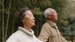 © CYBERPINK - Elderly couple standing in a bamboo forest. the woman is on the left side of the image, with her eyes closed and her head tilted back, as if she is in a meditative state.