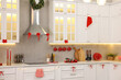 © New Africa - Stylish kitchen with Christmas decor. Interior design