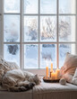 © Vitali - A window frosted with snow frames a scene of candles, pillows, and a sleeping cat on a couch.