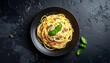 © fasha - Delicious Spaghetti Carbonara Dish on a Black Plate