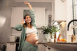 © milanmarkovic78 - Pregnant Woman Dancing In Kitchen