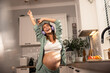© milanmarkovic78 - Pregnant Woman Dancing In Kitchen