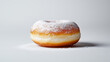 © Vladyslav - Fresh donut with powdered sugar placed on a plain white background during daytime