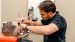 © ADDICTIVE STOCK - Barber offering precision beard trim with care