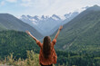 © SHOTPRIME STUDIO - Person with arms raised in mountains nature and valley feeling freedom authenticity inclusivity outdoor landscape