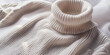 © PujiRahayu - Creamy white knitted turtleneck sweater with soft folds and textures.