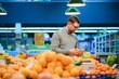 © Serhii - Man buying vegetables and fruit in grocery store, zero waste concept