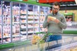© Serhii - man choosing cheese in supermarket