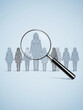 © MuhammadFarooq - Magnifying glass focuses on one person silhouette from the group. Symbol of talent search employee recruitment. Concept of selection finding the best candidate for the job. Human Resources / Recruitme