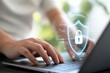 © Hriday - Digital Safeguard: A close-up view of hands typing on a laptop keyboard, a digital shield and padlock, symbolizing cybersecurity and data protection.