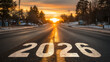 © wanavit - Business concept sunrise on empty road with painted 2026 marking and soft snow creating hopeful new year atmosphere
