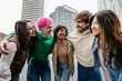 © Xavier Lorenzo - Multiracial group of cheerful students sharing a hug while laughing in the city, enjoying free time and celebrating friendship. Youth, community and lifestyle concept.