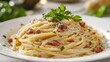 © toomi123 - Spaghetti Carbonara on a white porcelain dish