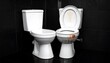 © Tali - Two white ceramic toilets are placed side-by-side. One is clean and the other one is stained, showing signs of use and neglect