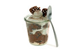 © Richard Villalon - Verrine de tiramisu maison aux speculoos avec une cuillère en gros plan isolée sur fond blanc