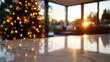 © Milos - A warm sunset casts a beautiful glow on a Christmas tree decorated with lights, creating a magical and cheerful atmosphere in this cozy indoor space.