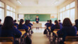 © Sanjaya - Blurred School Classroom with Students and Teacher During Lesson , Education and Childhood Learning Environment