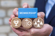 © wladimir1804 - Business person holding blocks with icons sees the word MEMBERSHIP. Concept of membership. Business company join us.