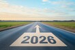 © oksa_studio - Paved road with painted 2026 number and an upward arrow, representing future direction and new year goals